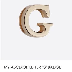 My ABC Dior letter “G” badge. Pale gold metal finish.